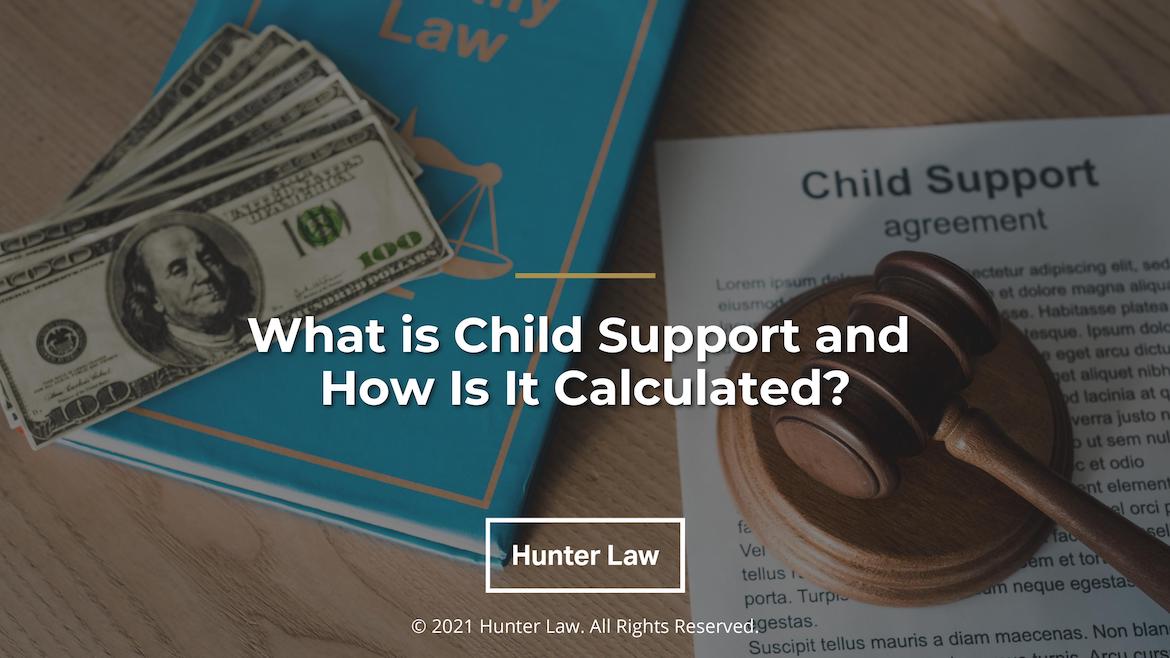 Desk with judges gavel on child support agreement-Title: What is Child Support and How Is It Calculated?