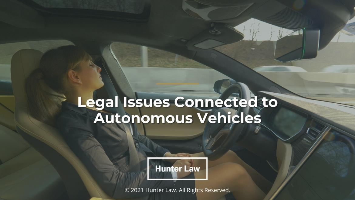 Featured-Young female napping in autonomous vehicle driving-Legal Issues Connected to Autonomous Vehicles