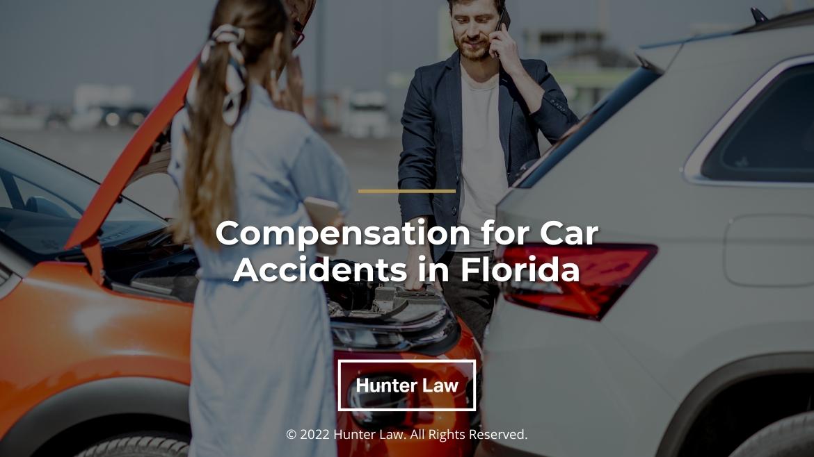 Featured: Two drivers inspecting car damage from accident - Compensation for Car Accidents in Florida