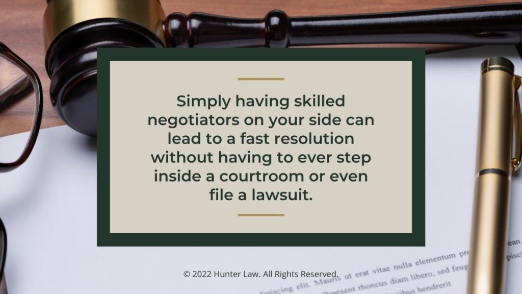 Callout 2: Personal injury claim form on desk with judges gavel and pen - Skilled negotiators on your side benefit you quote from text