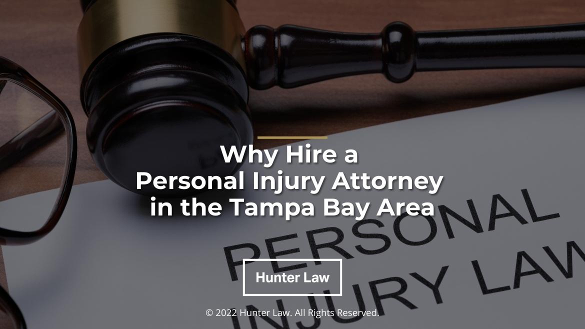 Featured: Personal Injury Law form on desk with judges gavel and glasses - Why Hire a Personal Injury Attorney in the Tampa Bay Area