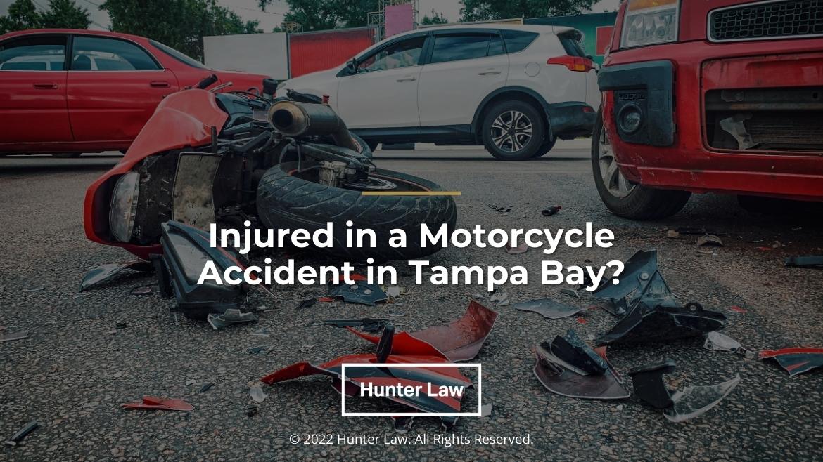 Featured: Motorcycle accident crash scene with broken pieces on road - Injured in a Motorcycle Accident in Tampa Bay?