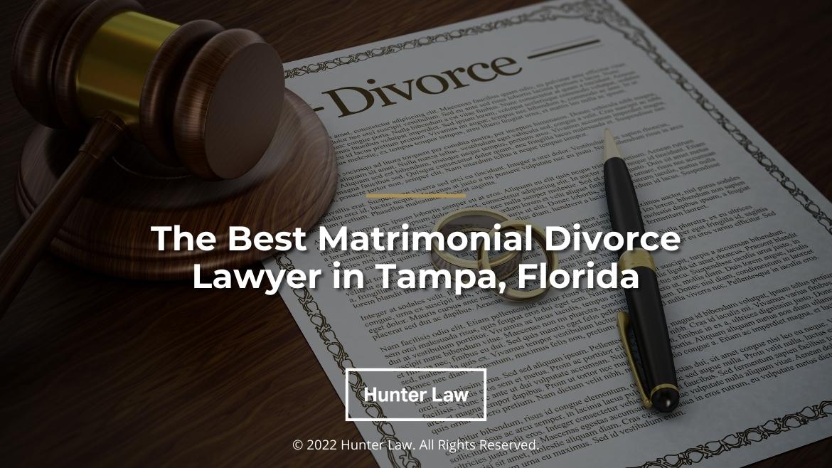 Featured: Divorce decree, judges gavel, 2 wedding band, pen on top of desk- The Best Matrimonial Divorce Lawyer in Tampa, Florida