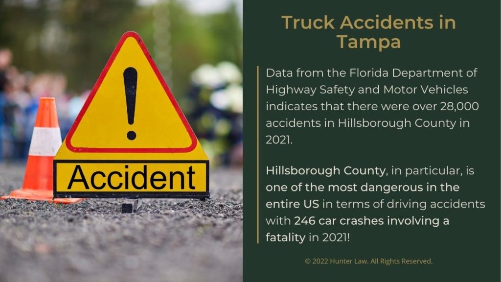Callout 1: Accident warning sign and warning cone on road- Truck accidents in Tampa- data from florida Dept. of Highway Safety facts