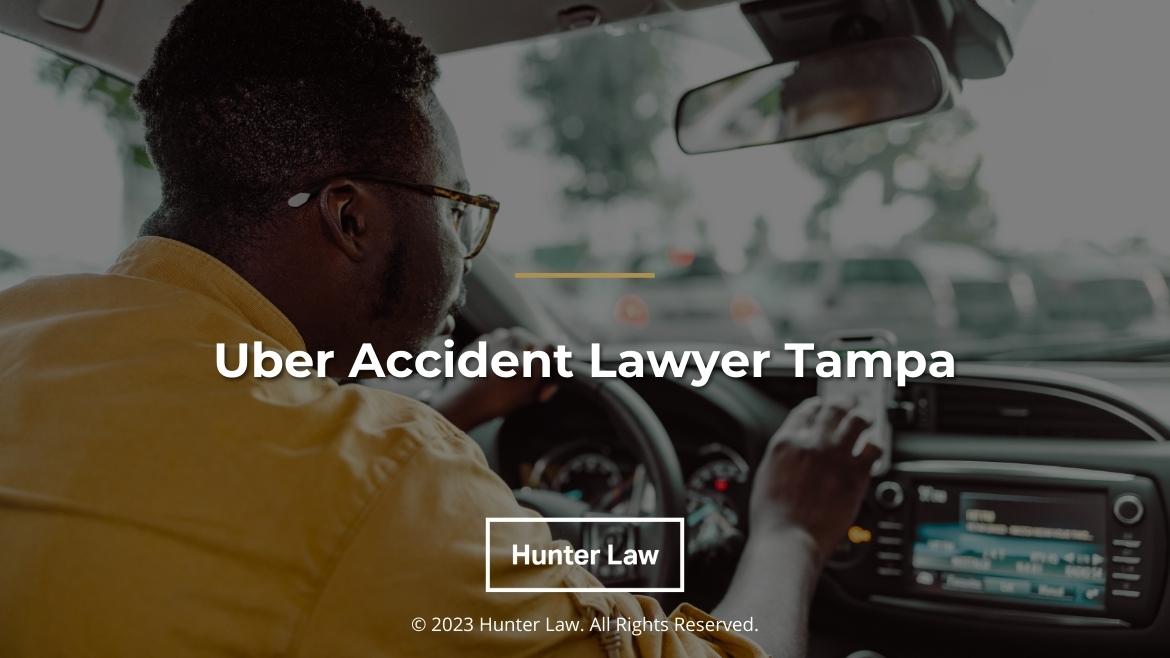 Featured: Uber driver checks smartphone on dashboard- Uber accident lawyer Tampa