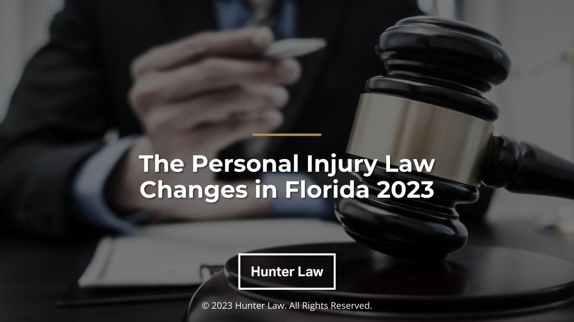 Featured: Lawyer at desk with law documents and judges gavel- The Personal Injury Law Changes in Florida 2023