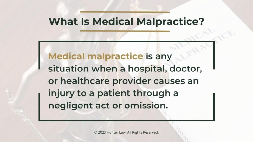 Callout 1: Law book next to Lady Justice on desk- What is medical malpractice? definition