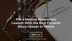 Featured: medical malpractice book next to Lady Justice- File a Medical Malpractice Lawsuit With the Best Personal Injury Lawyer in Tampa.