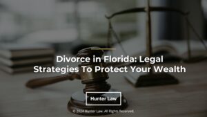 Featured: Judges gavel and balance scale on desk- Divorce in Florida: Legal Strategies to Protect Your Wealth.