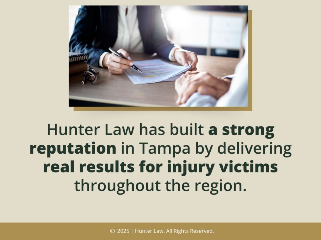 Lawyer meeting with client reviewing document- Hunter Law has a strong reputation for personal injury victims.