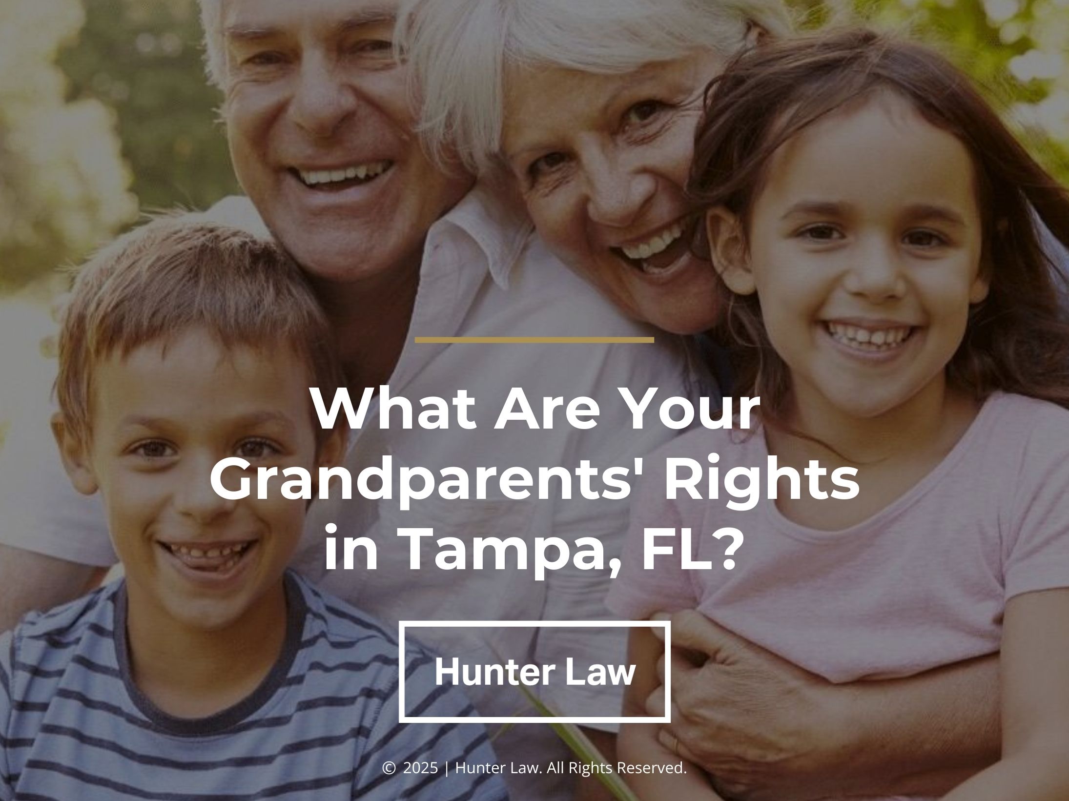 Grandparent couple holding their two grandchildren smiling- What are your grandparents' rights in Tampa, FL?