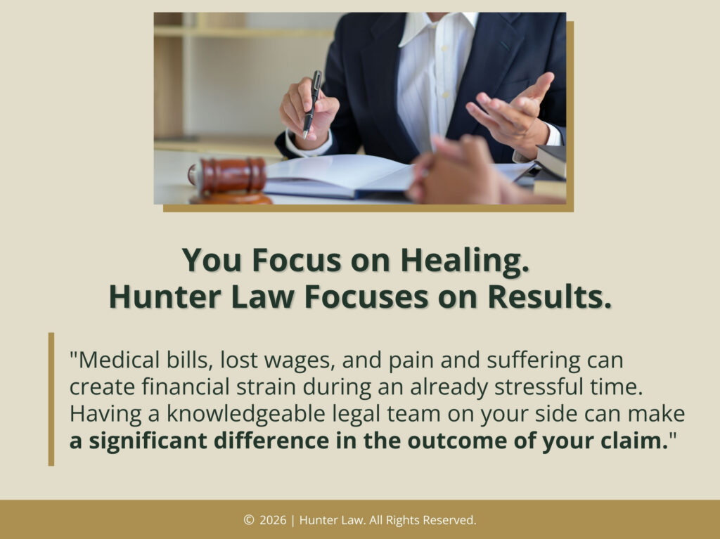 Injury attorney consulting with a client at his desk- quote from text about having a knowledgeable legal team on your side.