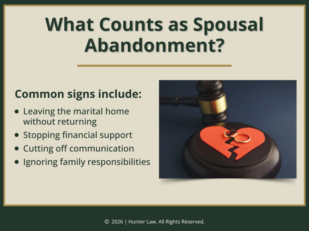 Torn paper heart with two wedding rings and gavel on desk. Four signs that count as spousal abandonment.