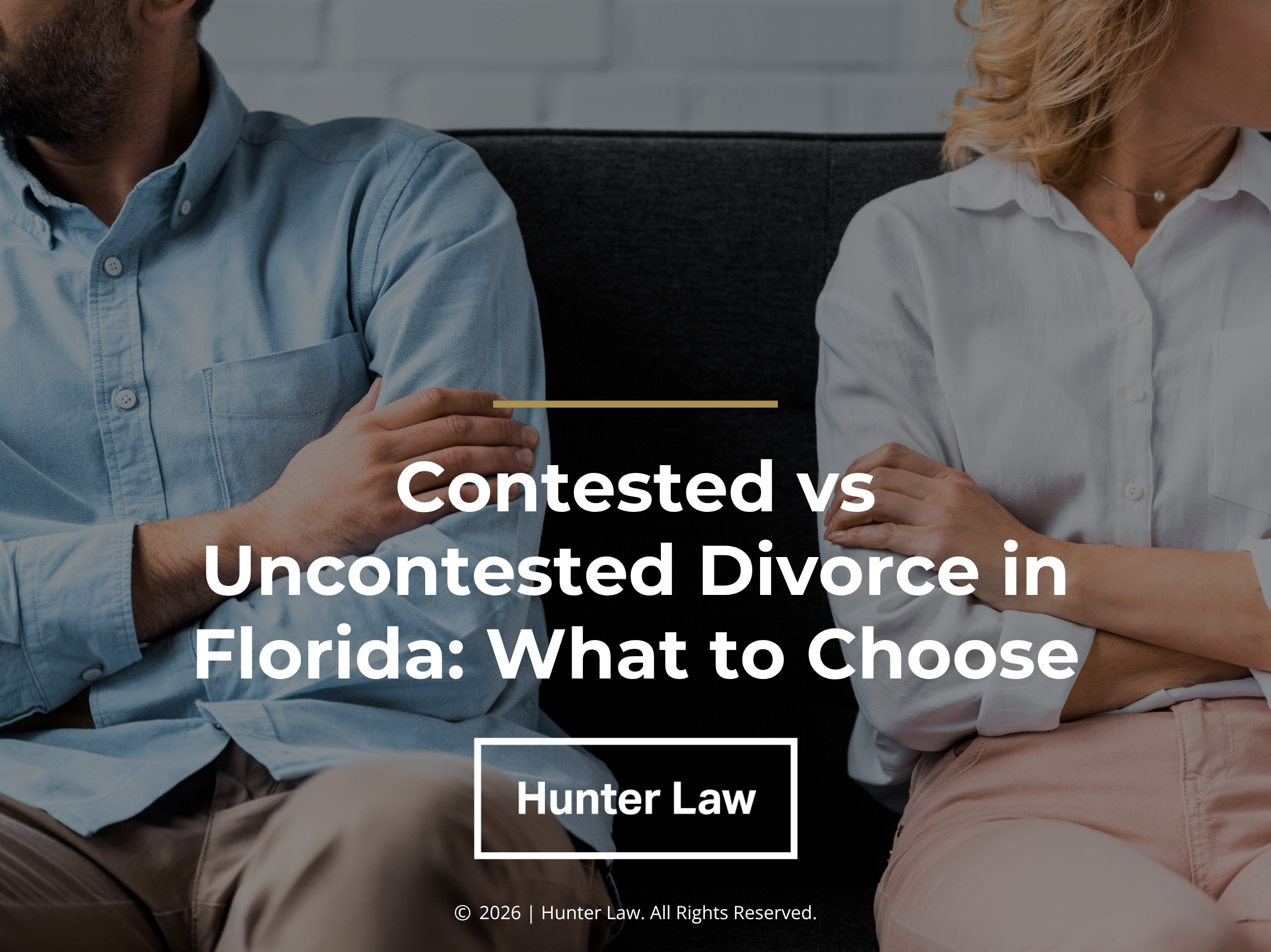 Man & woman sit apart on couch with crossed arms. Article title.